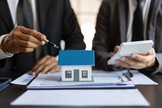 Mortgage lenders sitting around a model house