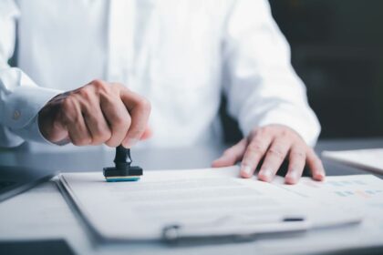 A process server preparing a document for service of process