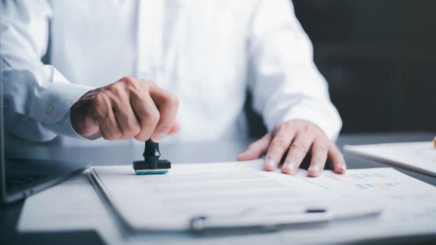A process server preparing a document for service of process