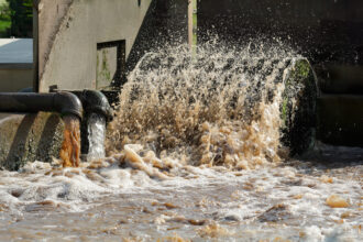 Forensic engineering expert analyzing wastewater treatment systems.