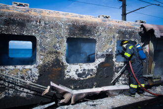 Person Investigating the scene of a fire