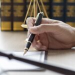 Lawyer signing documents