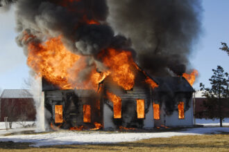 Certified fire investigation expert analyzing arson scene in Covington, LA